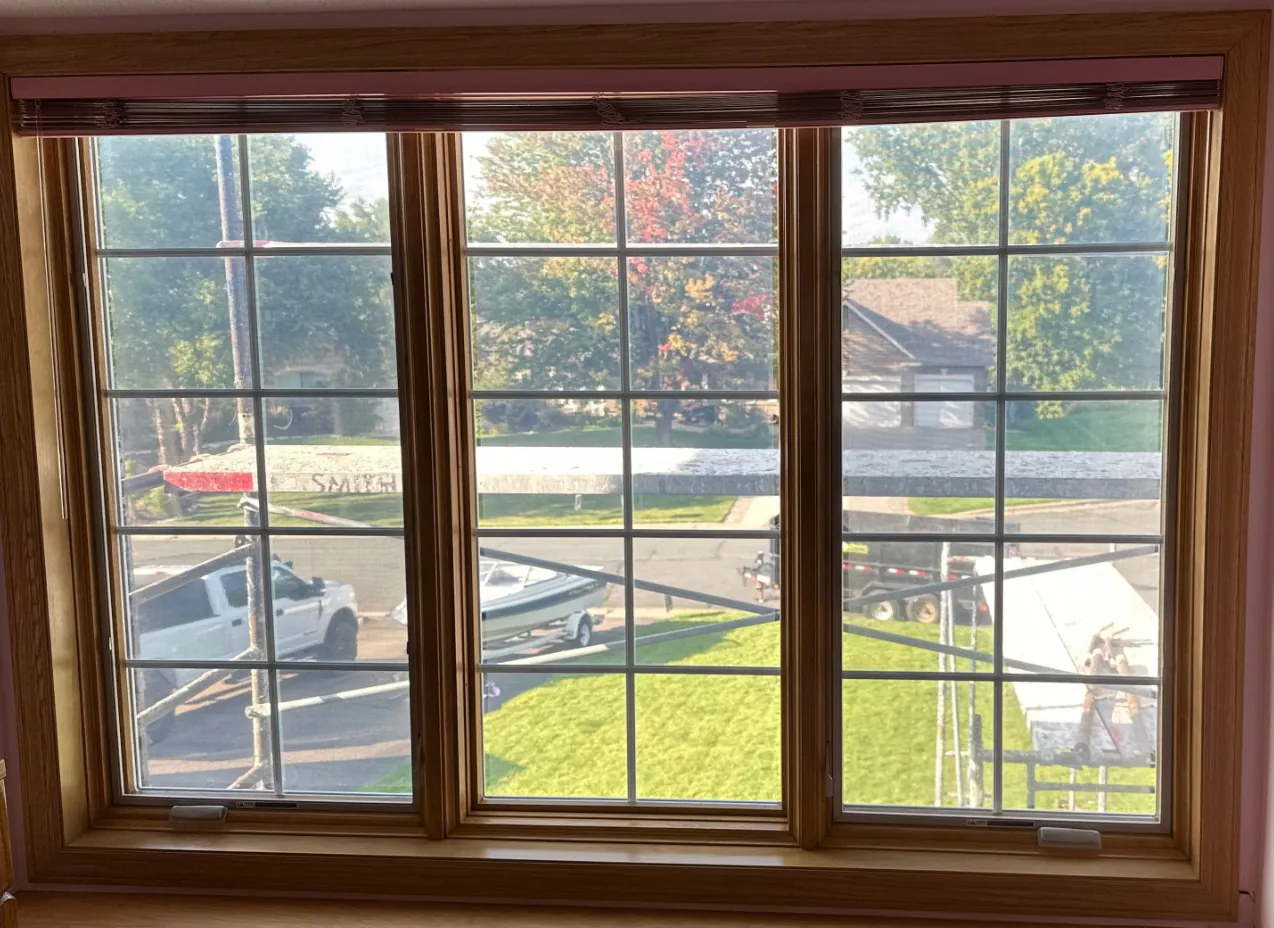New windows stained to match the original oak trim, Mendota Heights